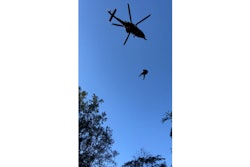 A Maryland State Police helicopter lowers a medic down to aid an injured hunter. (Photo: Maryland State Police)