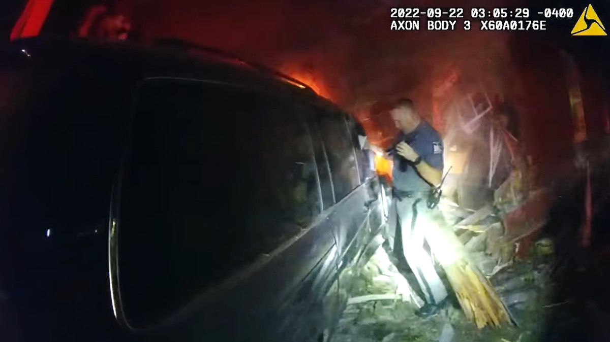 Body-worn camera video captures when two troopers rescued a teen from a vehicle fire.
