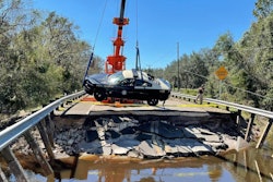 A Florida state trooper’s patrol car is hoisted from the water after being washed away with a trooper inside Sept. 29. The trooper was not injured.