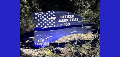 The Nelson County Sheriff’s Office is investigating the theft of this flag memorial dedicated to Jason Ellis, a Bardstown police officer who was fatally shot and killed in the line of duty in 2013.