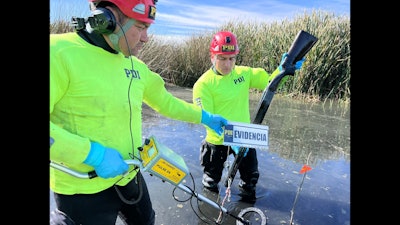 Detectives recover a shotgun found submerged in the Río Elqui River Wetlands, in Chili, by using a Pulse 8X underwater metal detector.