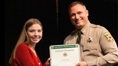 Clay County Sheriff Will Akin presents award to Ava Donegan. (Photo: Clay County Sheriff's Office/Facebook)