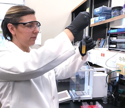 A GBI forensic chemist performs an extraction looking for the presence or absence of an illegal drug.