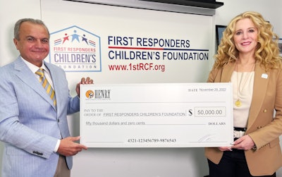Henry Repeating Arms CEO and founder Anthony Imperato presents a $50,000 donation to FirstResponders Children’s Foundation president and CEO Jillian Crane at the organization’s headquarters in New York City.