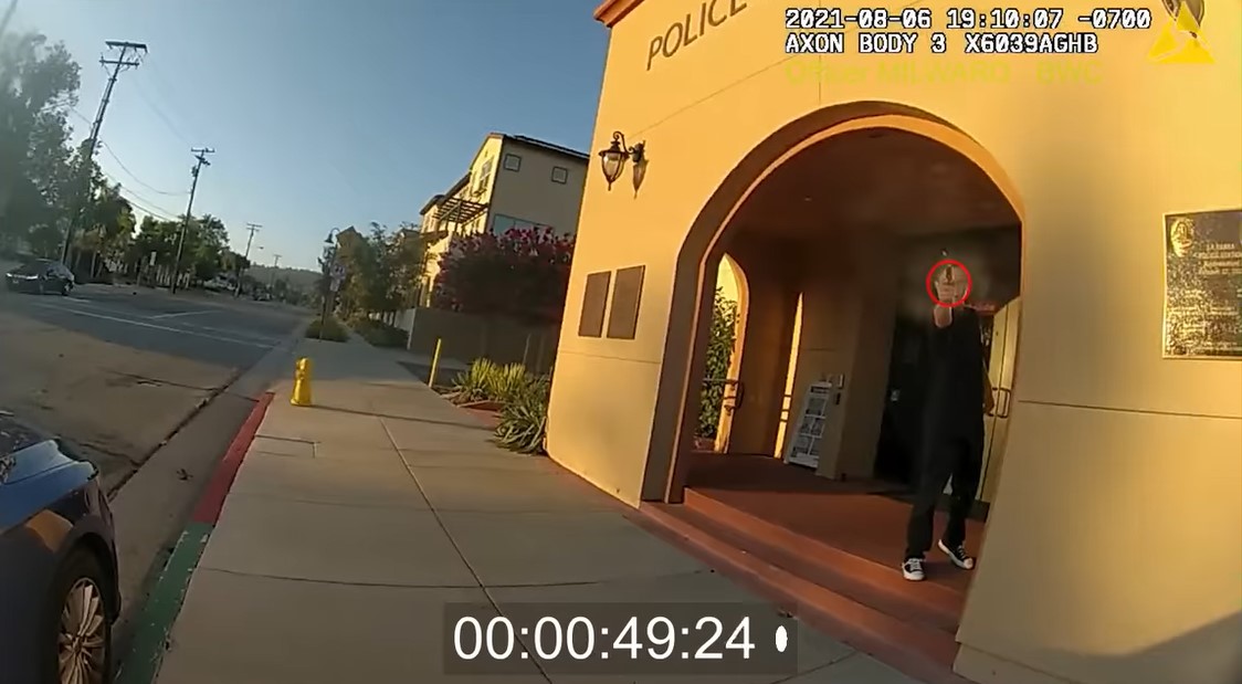 Still from body-worn camera video shows gunman shooting at Officer Milward. A second officer returned fire and killed the suspect. (Photo: Orange County DA)