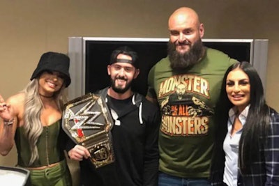 Bristol police officer Alex Iurato holds a WWE belt while posing with Liv Morgan, left, Braun Strowman and Sonya Deville. (Photo: Bristol Police Department)