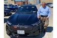 NYPD Deputy Commissioner Robert Martinez stands with the agency's first Ford Mustang Mach-E in August 2022. This vehicle is used for administrative duties. (Photo: Courtesy of Robert Martinez)