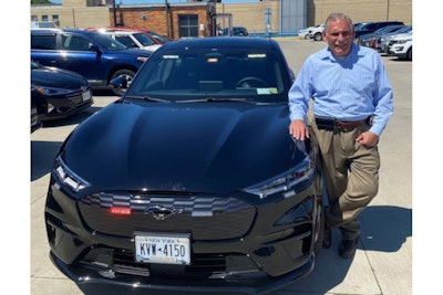 NYPD Deputy Commissioner Robert Martinez stands with the agency's first Ford Mustang Mach-E in August 2022. This vehicle is used for administrative duties. (Photo: Courtesy of Robert Martinez)