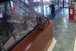 A front desk officer confronts an armed gunman who entered the lobby in December.