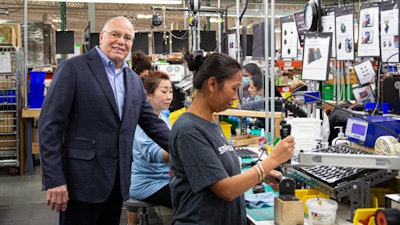 Streamlight CEO Ray Sharrah visits the TLR production line earlier this week. He has worked with the company for most of its 50 years.
