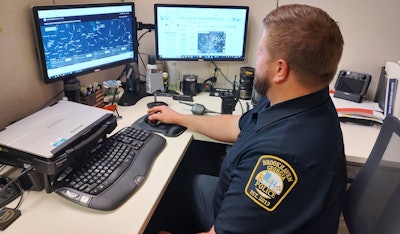 Officer Ben Shuler, a teleoperator, mans the DFR system inside police headquarters.