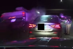 A trooper's dashcam documents the moment a passing truck hit the vehicle he had stopped.