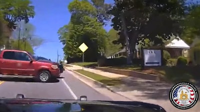 Police dashcam video shows a suspect losing control and crossing into the path of a Lawrenceville, GA, police vehicle just before the collision.