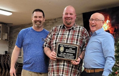 Joseph Johnson, center, receives the Outstanding Performance Award from the Nyssa Police Department, where he was a reserve officer. It was presented by Chief Don Ballou and City Manager Jim Maret.