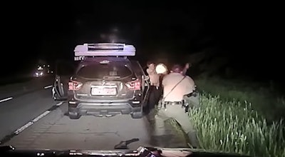 Still from Illinois State Police dashcam video that shows a suspect identified as Brandon Griffin firing on troopers.