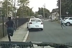 Still image of suspect running away with gun that was released by Lakeland Police.