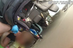 Hillsborough County, FL, Sheriff's Deputy Donnie Rizer reaches out to a small child in an overturned van.