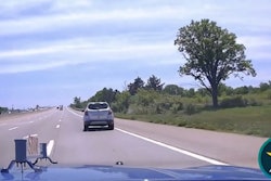 Still image from Michigan State Police video showing trooper pursuing 10-year-old driving SUV.