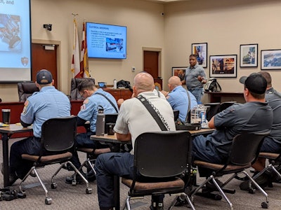 Chris Womack, of AFV Educate, leads first responders in a training about alternative-fuel vehicles.