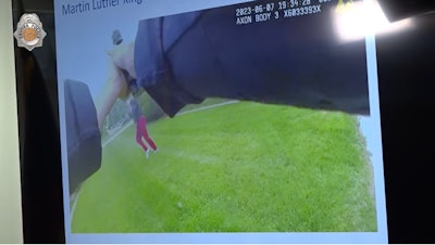Still from Denver officer's body camera showing juvenile firing at officer.