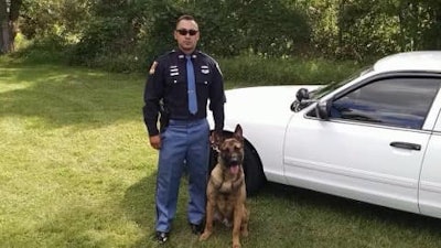 Gary Police Cpl. Angel Lozano with his K-9 partner Falco who was shot and killed last week after serving eight years.