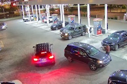 Chattanooga Police Officer Celtain Batterson approaches the suspect's SUV. Batterson was shot in the arm during the incident.