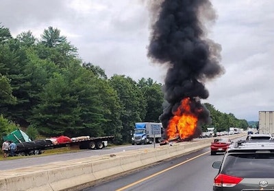 A Massachusetts state trooper rescued two women from this burning SUV Saturday.