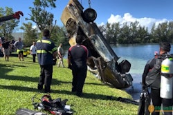 Law enforcement from Dade County, FL, recovers car from a Doral lake. Dozens have to be recovered. Already, some have been identified as stolen.