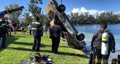 Law enforcement from Dade County, FL, recovers car from a Doral lake. Dozens have to be recovered. Already, some have been identified as stolen.