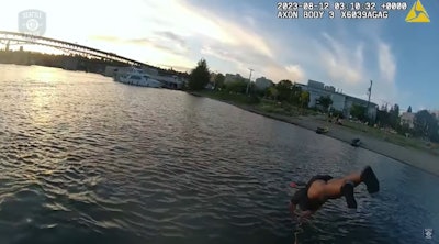 Seattle Harbor officer dives into the bay to rescue a drowning man.