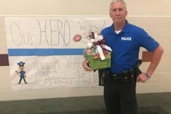 Officer Bryan Holley on duty in a Hudson, TX, school. He died Friday after a medical crisis on duty.