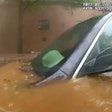 Vehicle submerged in downtown Atlanta flood waters. The occupant was rescued by an officer and a firefighter.