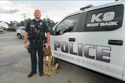 K-9 Waro and his Clayton County Police handler. Waro, a German shepherd, was killed early Saturday morning.