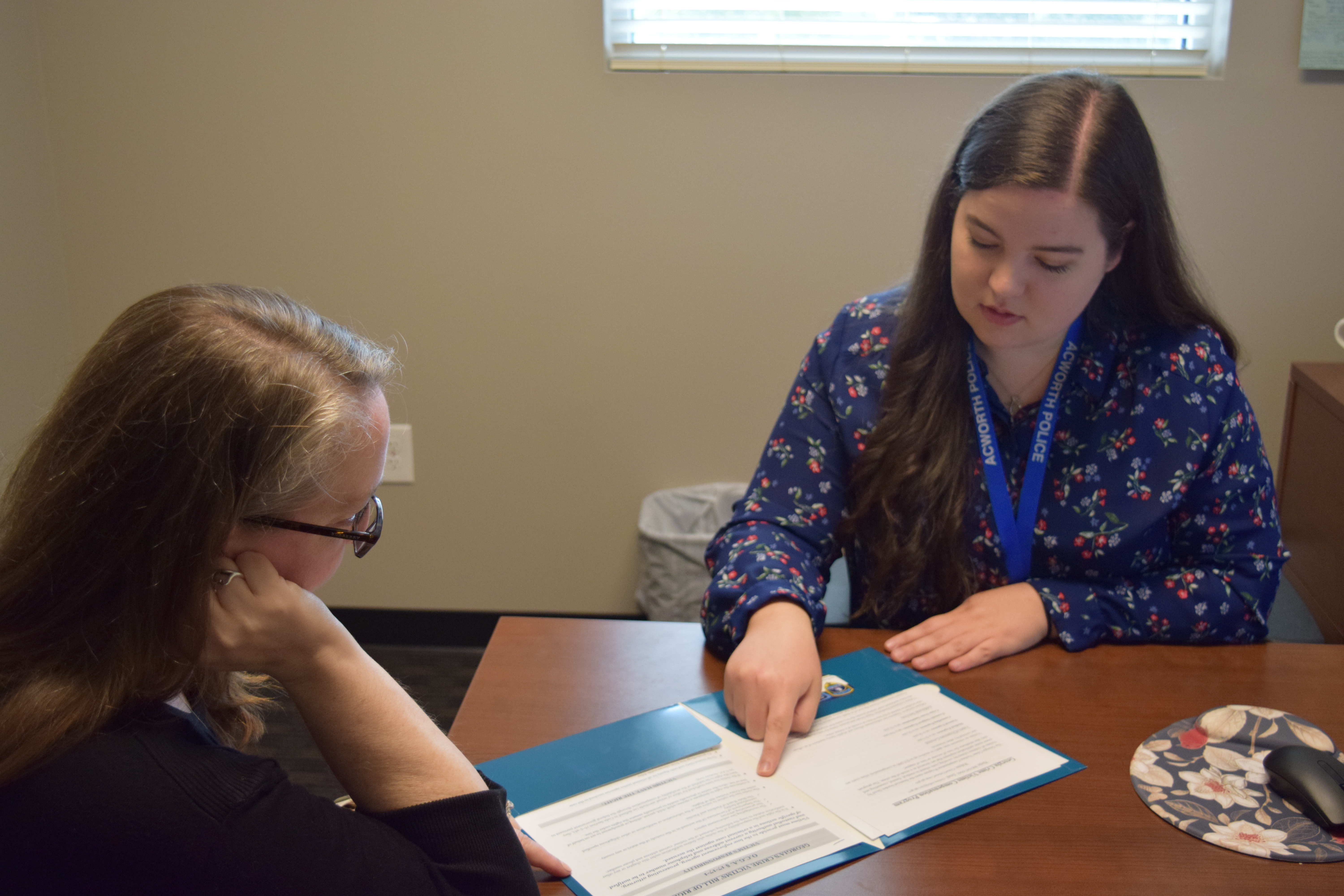 Victim advocate Emily Hall of the Acworth Police Department demonstrates how she helps people affected by crime.