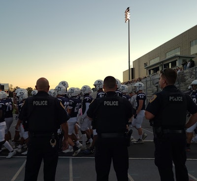 Chambersburg police officers work a local high school football game.