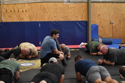 Tom Nagel, the health and fitness coordinator for the Forsyth County Sheriff's Office, supervises an exercise session for deputies.