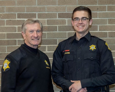 Richland County, SC, Sheriff Leon Lott with Jacob Eric Salrin at the deputy's academy graduation.