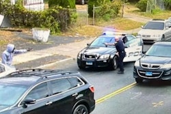 Still image from video released by City of Hartford shows police officer engaging armed suspect at less than a car length of range. The suspect was killed. The officer was not injured.