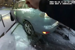 Boulder, Colorado, officers approach a crashed vehicle perched on a retaining wall. They were able to work with firefighters to rescue a toddler and the driver.