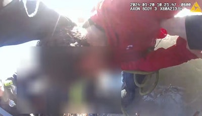 Jonesboro, Arkansas, police officer Troy Ellison pulls a child out of a frozen pond.