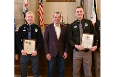 Honored Friday for their bravery were Nebraska State Trooper Alex Coffman, left, and Lincoln County Deputy Sheriff Tyler Schultz, flanking Gov. Jim Pillen.