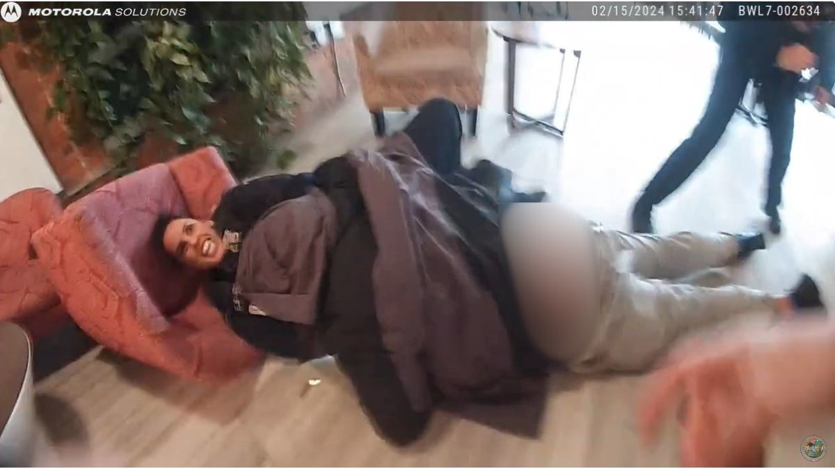 The officer is pinned under the suspect as he fights for her gun, gets it, and fires a shot striking the officer in the leg.