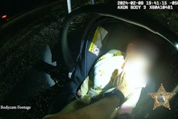 Sgt. Dave Musgrove of the Charlotte County Sheriff's Office performs chest compressions on an infant injured in a Feb. 8 crash.