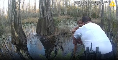 A deputy from the Hillsborough County (Florida) Sheriff's OIffice rescues a five-year-old girl who wandered off into a swamp area.