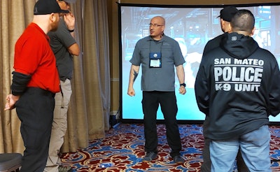 Lon Bartel instructs fellow trainers before the start of a scenario.