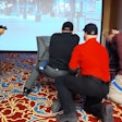 Trainers participate in a scenario that requires them first to apply a tourniquet, then stay in the fight and engage a threat during a VirTra simulation led by Lon Bartel.