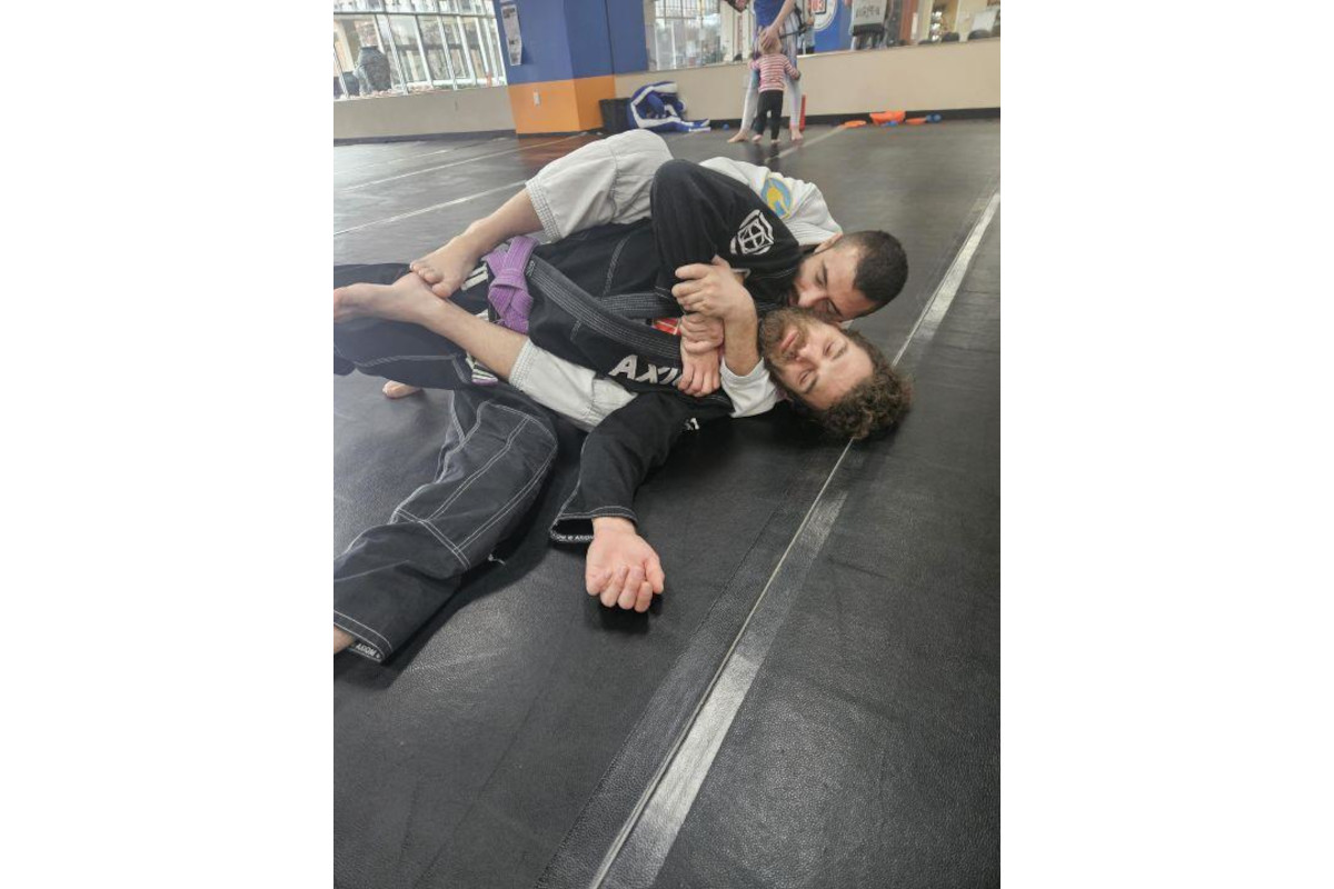 By establishing back control with the arrestee in the supine position, officers limit the arrestee's mobility and options, making it difficult for them to resist, access weapons, or attempt an escape.