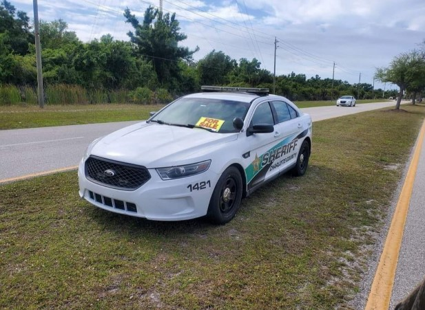 Facebook image of a Charlotte County, Florida, Sheriff's patrol vehicle with 'For Sale' sign.