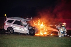 A Lewiston Police officer was pulled from this crashed patrol vehicle Wednesday. The SUV hit the rear of a tractor-trailer truck and ignited.