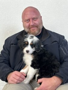 Deputy Ryan Falkner with Leo, the department's new senior resource dog.